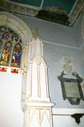 the side of the chancel showing damaged roof
